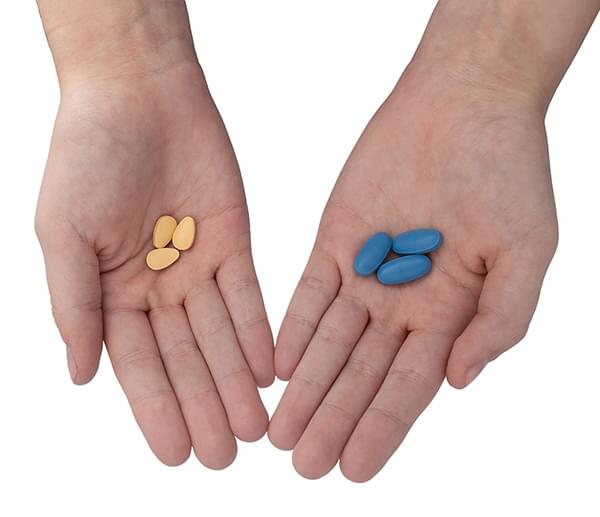 hands holding pills